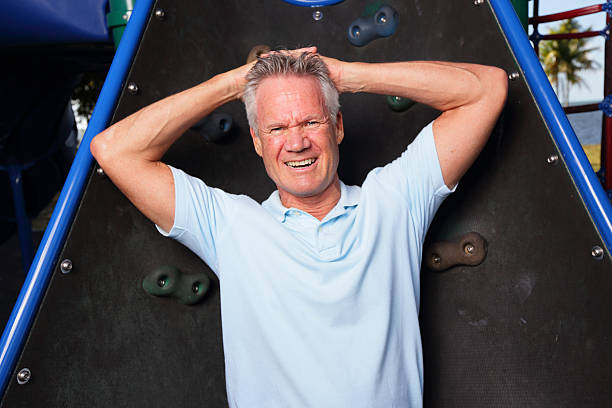 istock Handsome senior with arms on head 472611288