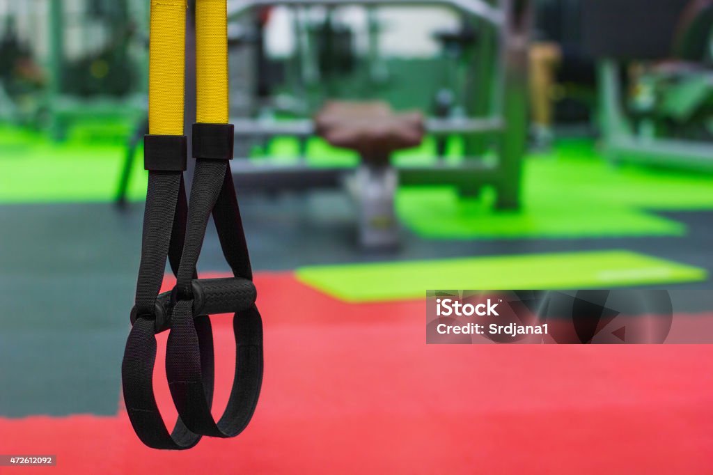 Hanging fitness strap, TRX with copy space Suspension training in gym, copy space Cross Training Stock Photo