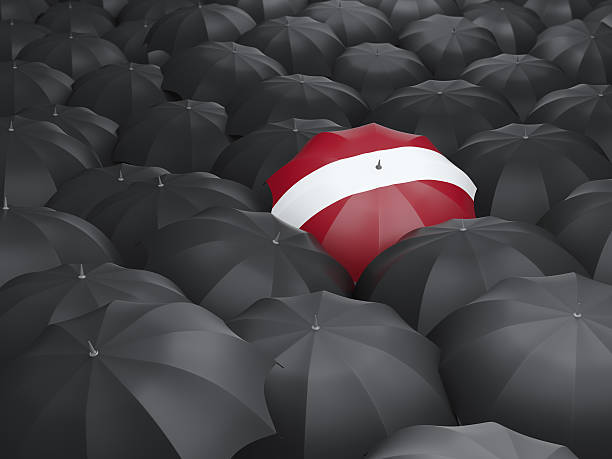 istock Umbrella with flag of latvia 472612604