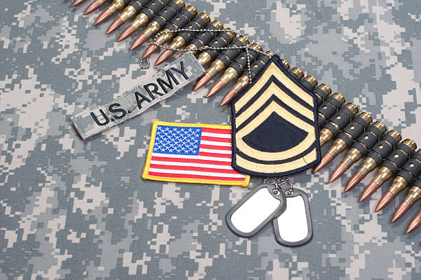 istock US ARMY concept - camouflage background with US flag 472612808