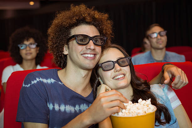 istock Young couple watching a 3d film 472617036