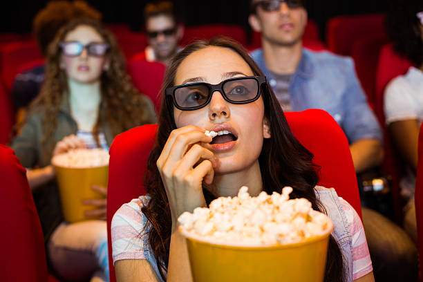 istock Young friends watching a 3d film 472617066