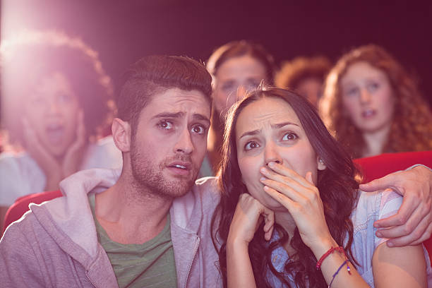 istock Young couple watching a film 472617386