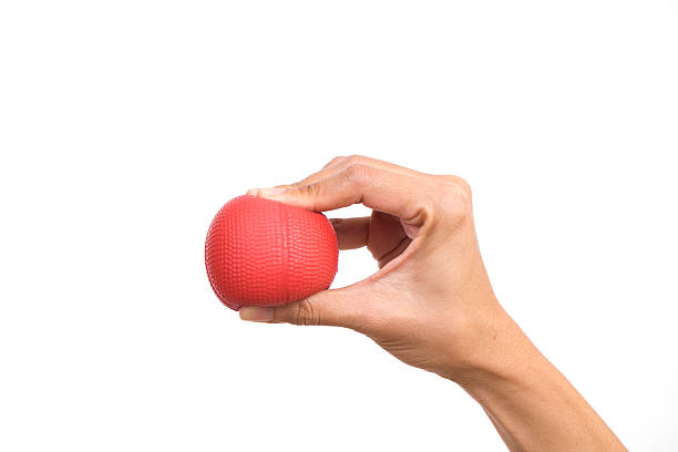istock Hands of a woman squeezing a stress ball 472617544