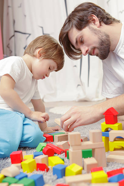 istock Father and son play together 472617690