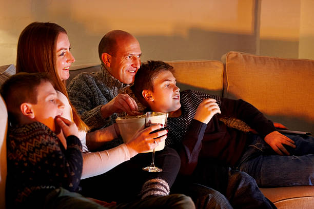 istock Family enjoying watching television 472617908