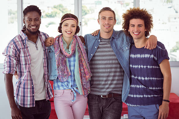 istock Fashion students smiling at camera together 472619754