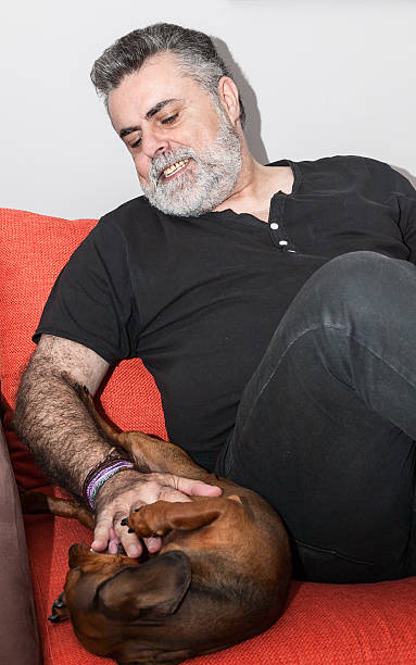 istock Attractive Senior with white beard smoking electronic cigarette 472620296
