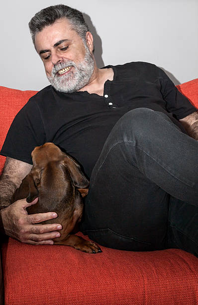 istock Attractive Senior with white beard smoking electronic cigarette 472620316