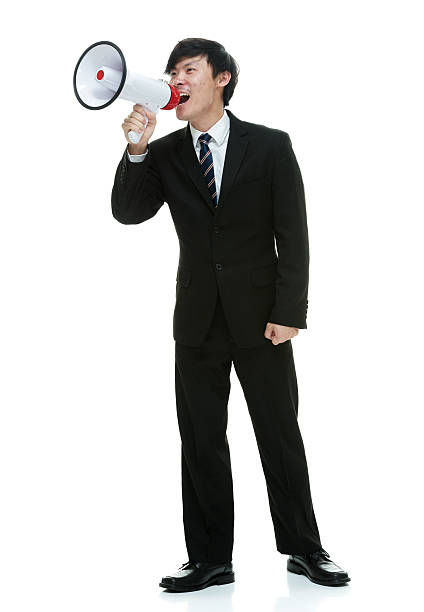 istock Businessman shouting with megaphone 472620588