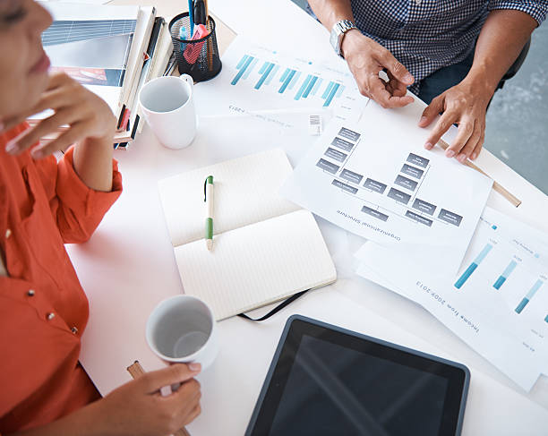 istock Going over the company financials 472621014