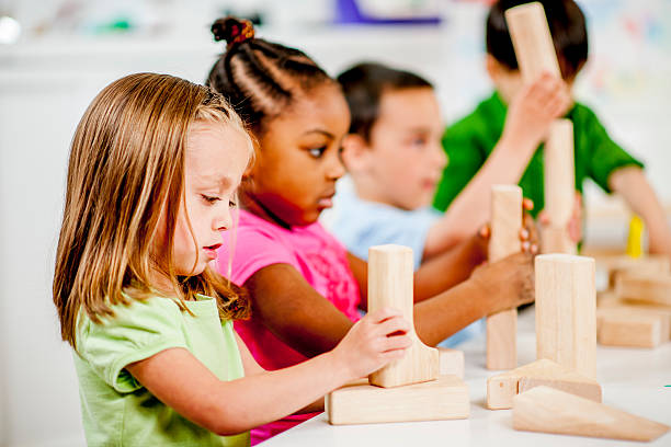 istock Children Playing with Toy Blocks 472623454