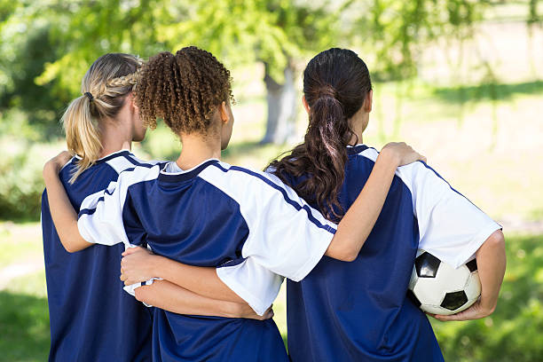 istock Pretty football players celebrating their win 472623664