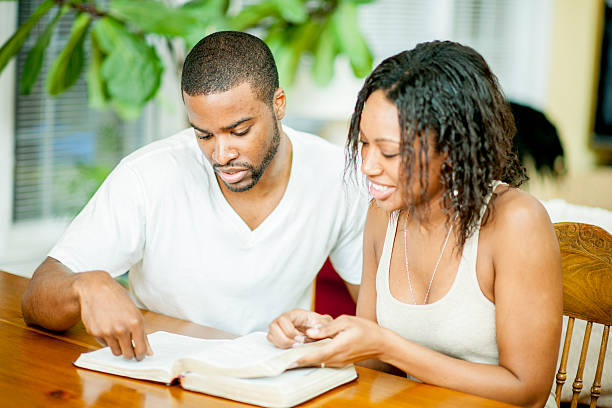 istock Husband and Wife Studying the Bible 472624102