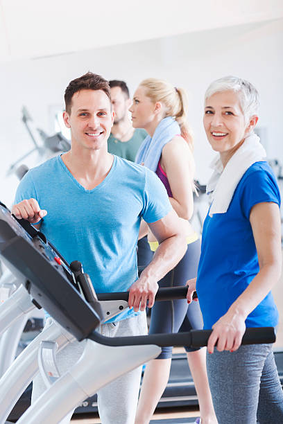 istock People running on treadmill at gym 472624956