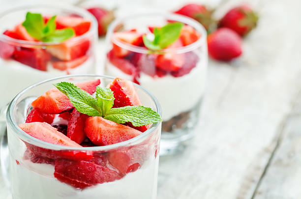 istock layered dessert with strawberries, chocolate biscuit cake and cream cheese 472625546