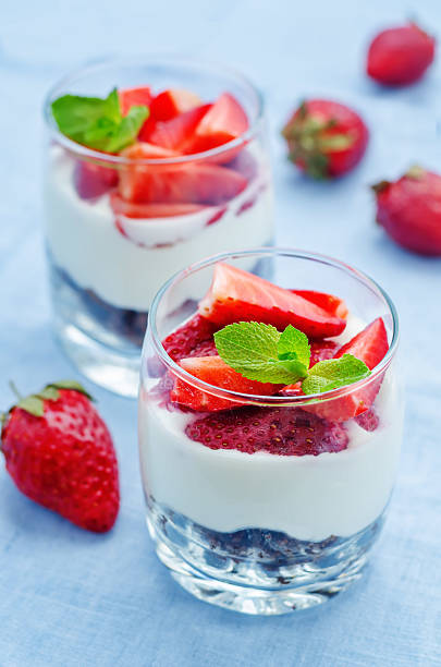 istock layered dessert with strawberries, chocolate biscuit cake and cream cheese 472625612