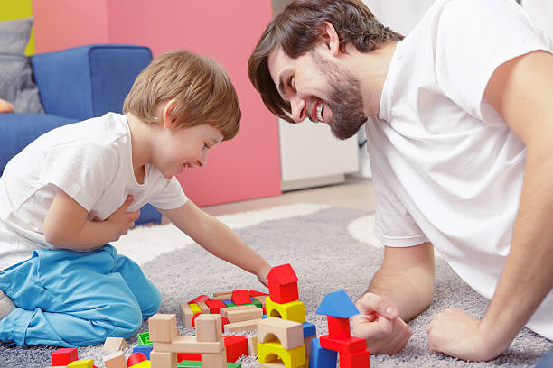 istock Father and son play together 472626118