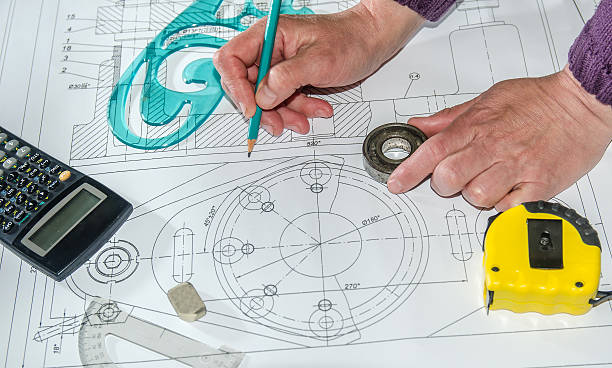 istock engineering drawings with hands drawing  project by pencil on paper 472633258