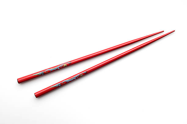 istock Red Wooden Chopsticks Isolated on White 472633494