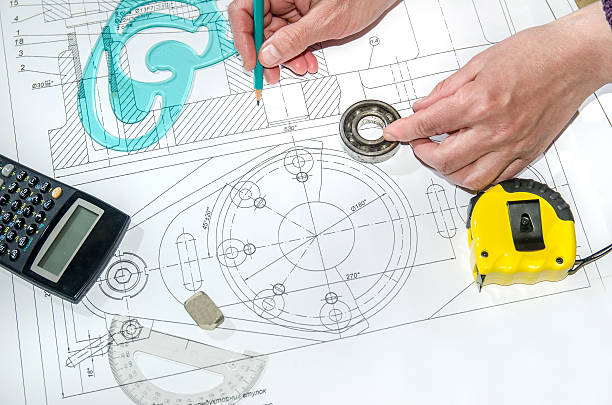 istock engineering drawings with hands drawing  project by pencil on paper 472633846