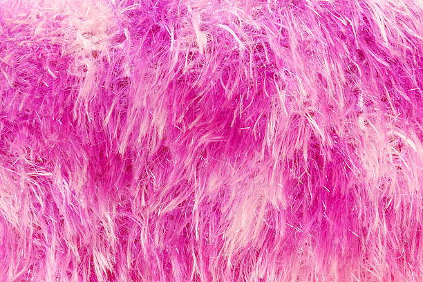 istock pink dyed sheepskin rug as a background 472634968