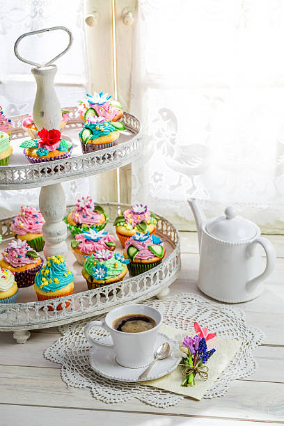 istock Delicious cupcakes with sweet decoration and coffee 472635656