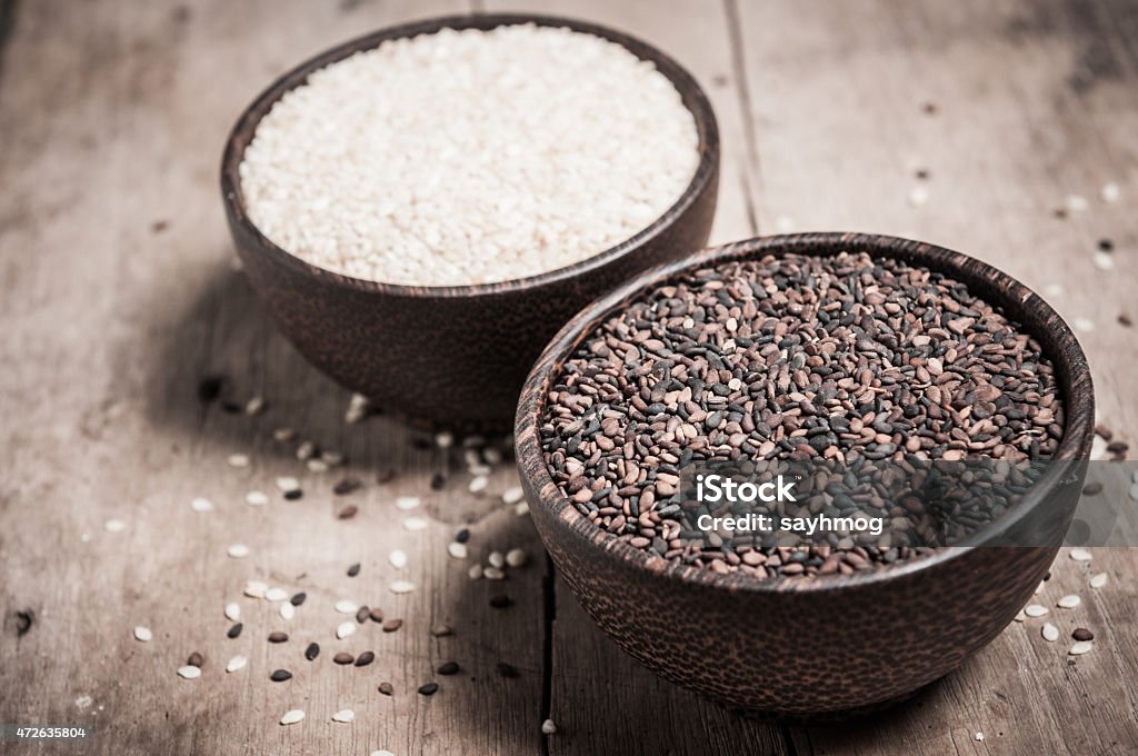 poppy and sesame in wood bowl closeup 2015 Stock Photo