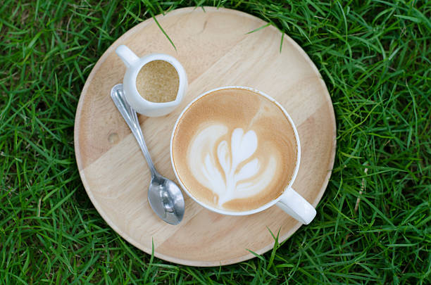 istock latte art on wooden plate 472636484