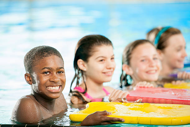 istock Children with Kickboards in Pool 472638706