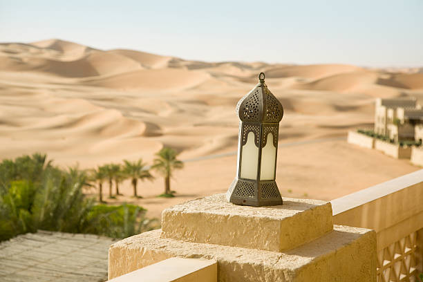 istock Sand desert, oasis, with arabic buildings and lamp 472639126