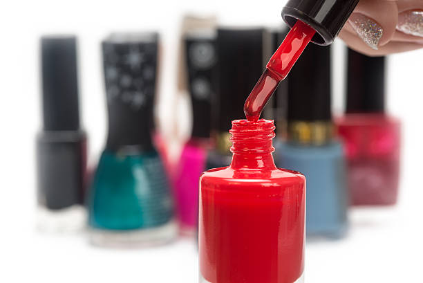 istock nail polish and female hand 472639648