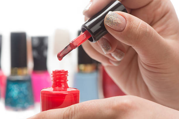 istock nail polish and female hands 472639664