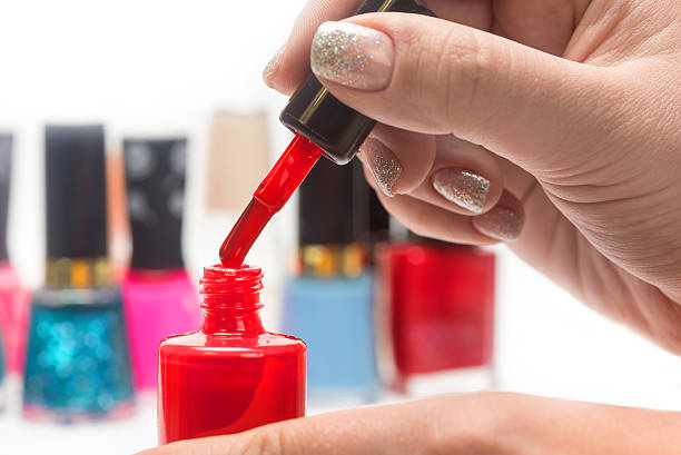 istock nail polish and female hands 472639670