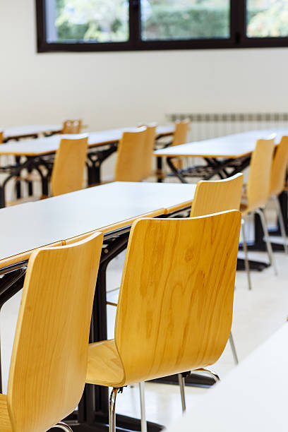 istock Desk and chairs in classroom 472639854