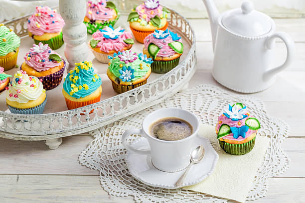 istock Sweet cupcakes with sweet decoration and coffee 472640298
