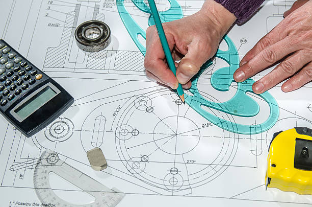 istock engineering drawings with hands drawing  project by pencil on paper 472641128