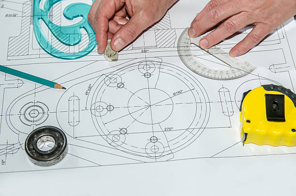 istock engineering drawings with hands drawing  project by pencil on paper 472641148