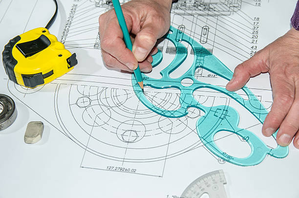 istock engineering drawings with hands drawing  project by pencil on paper 472641182