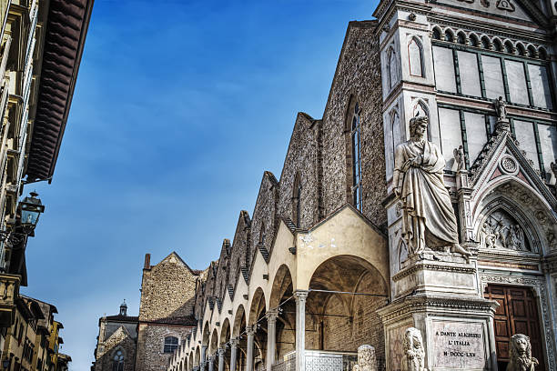 istock Dante Alighieri statue and Santa Croce cathedral 472641296