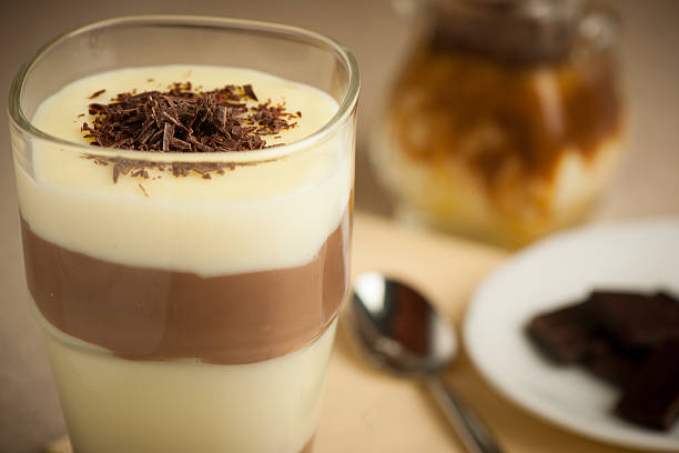 istock Mixed chocolate and vanilla pudding served in a glass decorated 472648058