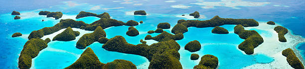 Palau islands from above Beautiful view of 70 islands in Palau from above. Wide panorama perfect for banners. palau beach stock pictures, royalty-free photos & images