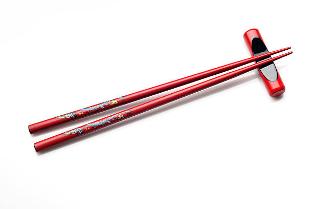 istock Red Wooden Chopsticks Isolated on White 472652780