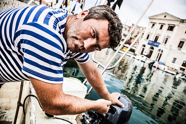 fisherman preparing his nets for a day of work on the sea.