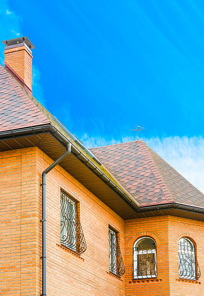 istock house with a gable roof window 472653820