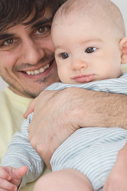 istock Father embracing newborn baby boy 472657722
