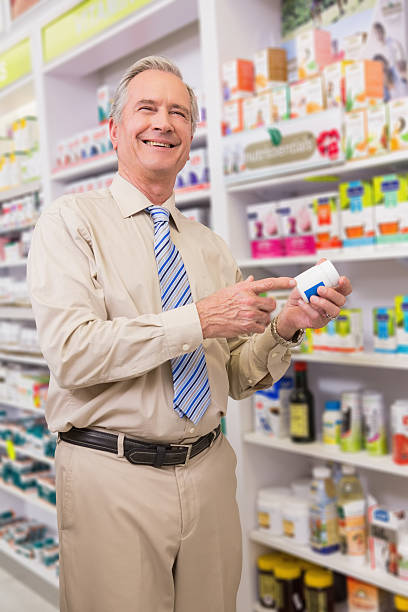 istock Smiling customer showing a medicine 472657756