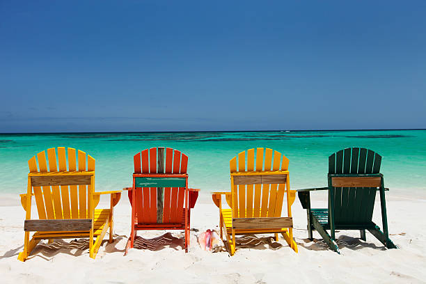 istock Colorful chairs on Caribbean beach 472659596