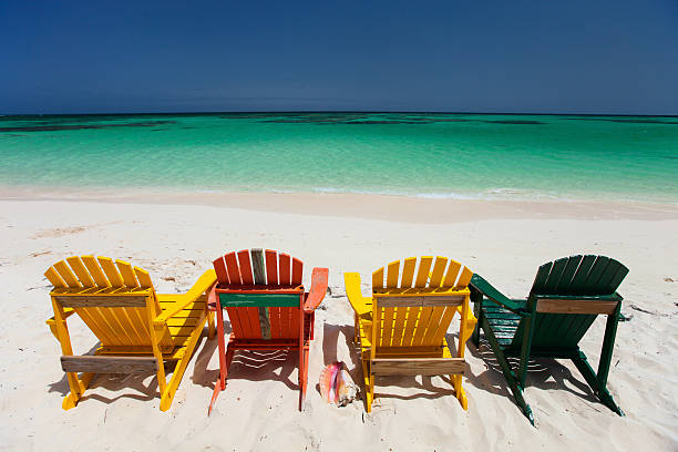 istock Colorful chairs on Caribbean beach 472659606