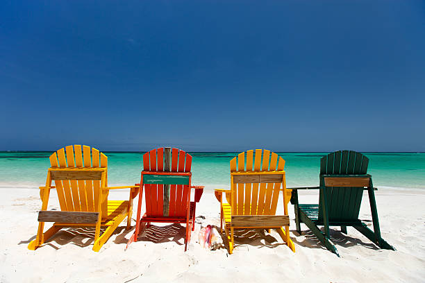 istock Colorful chairs on Caribbean beach 472659662